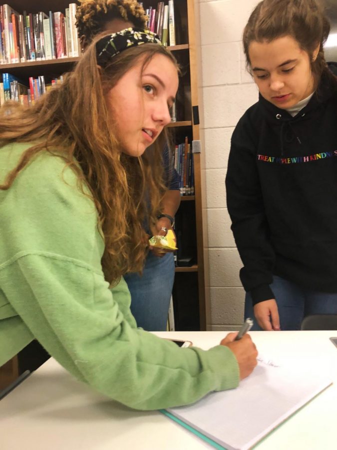 Student Council executive secretary Emma Guglielmo takes attendence at the last meeting before homecoming as they plan the last minute events for the dance on Saturday. Photo Credit: Smriti Tayal