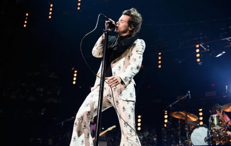  Styles belts out his notes while pulling off an full and white floral velvet suit. | credit: https://www.nme.com/news/music/harry-styles-new-song-watermelon-sugar-hosting-snl-2574658