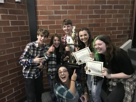 The theater program celebrates after winning their region competition. Left to Right: Josh Davis, Charlie Plese, Seth Christian, Jessi Kirtley, Chloe Taylor. Bottom Middle: Mrs.Stern
Photo credit: Seth Christian
