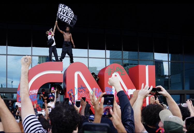 Protestors in Atlanta climbed on CNN sign in the front of network headquarters on Friday May, 29th.
Credit: Ben Gray/ Atlanta Journal-Constitution