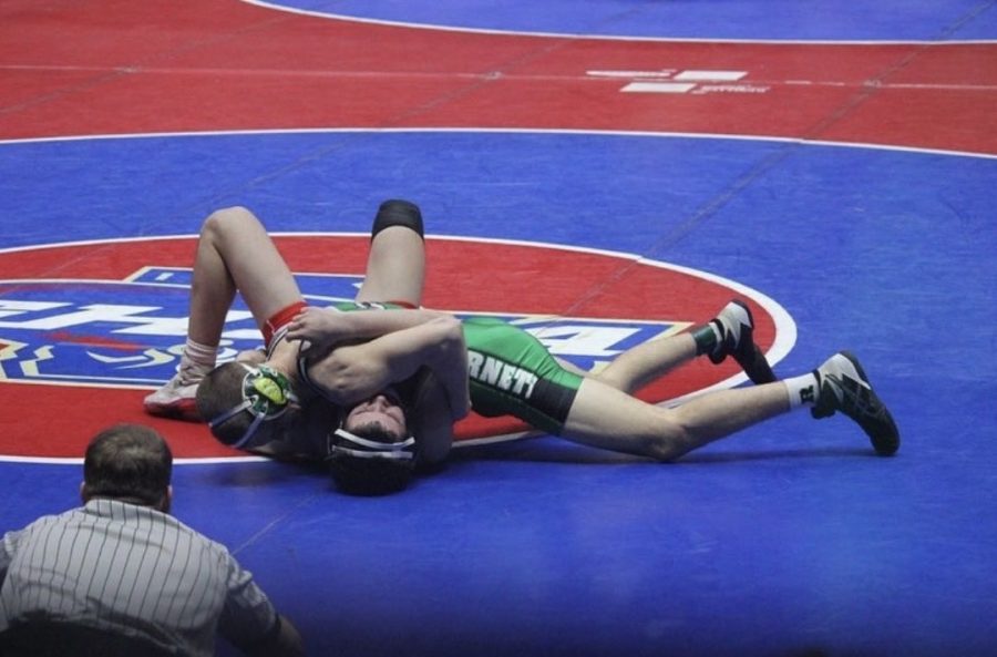 Thomas Rhodes pinning Jackson Guy at the State Championship (Credit: Amber Cloy Photography)
