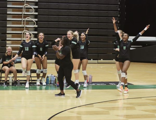 Coach Erika and her team celebrating after a great scoring play at home against Pope High School. (Credit: Mindy Wilson)