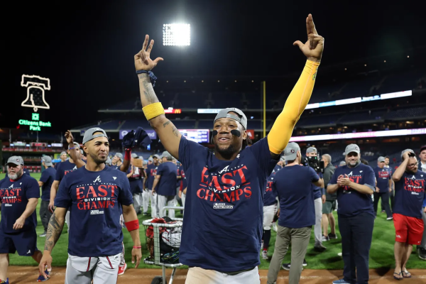Outfielder and star player Ronald Acuna Jr. celebrating after the teams sixth Nation League East division title. (Credit: Tim Nwachukwu/Getty Images)