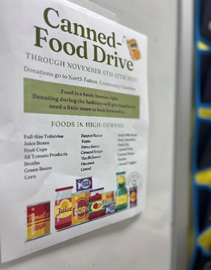 Canned-Food Drive poster hung up here at Roswell relating to NFCC coat drive. (Credit: Reese Neal)
