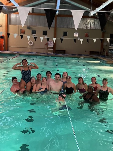 The swim team during one of their 5:30-6:30 AM practices at the Adult Aquatic Center. (Credit: Coach Klucsarits)