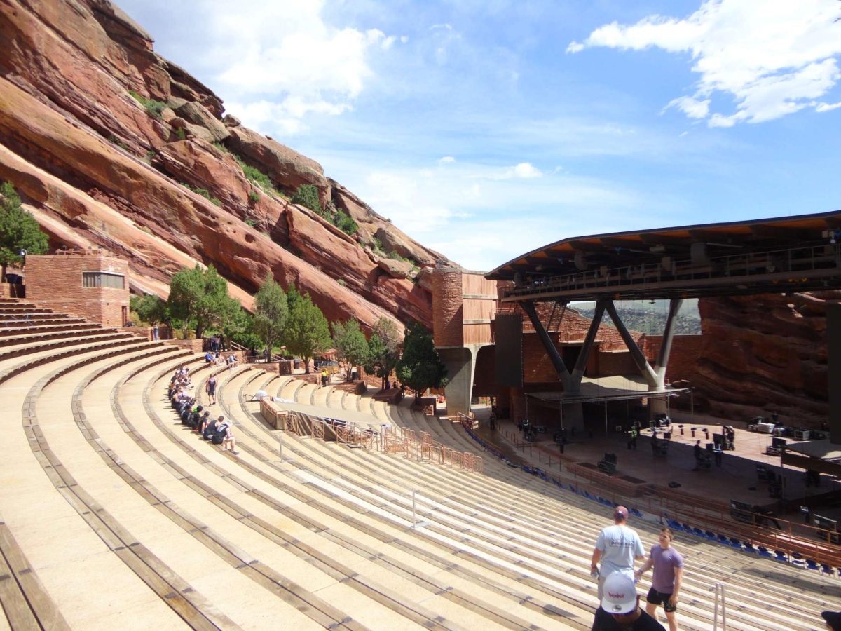 A view of the stunning spectacle of Red Rocks Amphitheater during the day where many people get a workout in on the more than 250 steps or throughout the park. A fun day adventure to see the beautiful views in a very different way than you would at a concert at night.