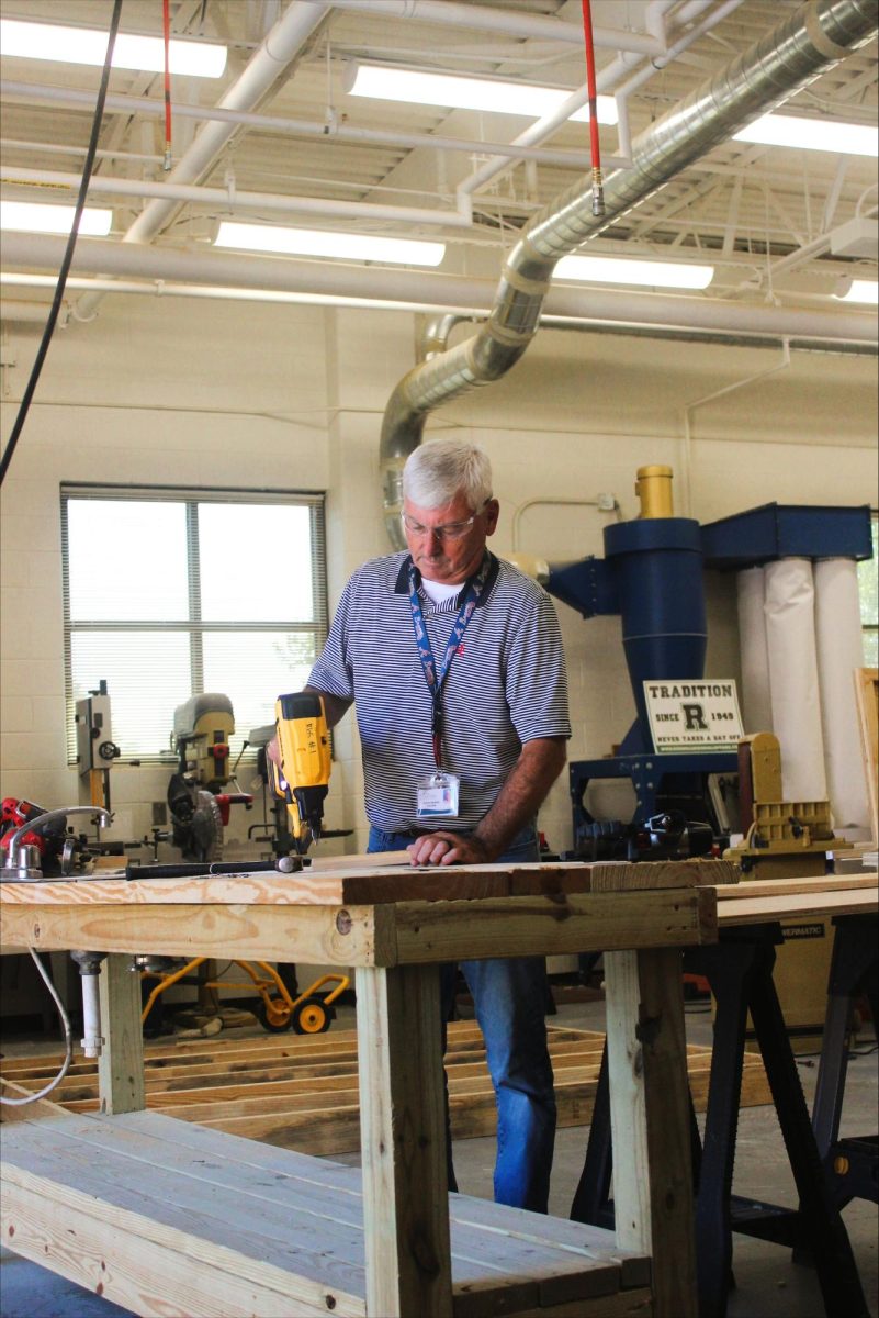 Newest RHS construction teacher Mr. Squires working hard to set an example for his students in the classroom.