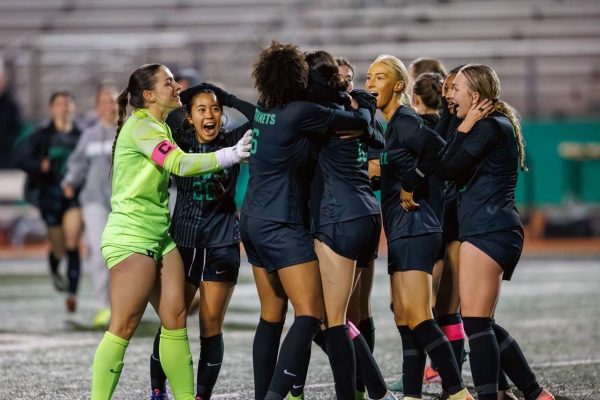 The lady Hornet's after an amazing goal to win their game. 