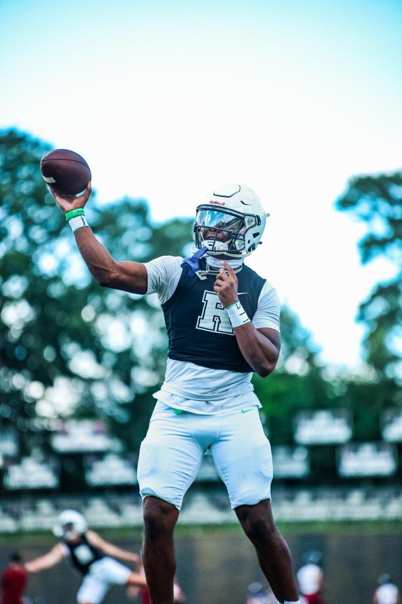 Senior quarterback Trey Smith throwing warm-up passes before the Roswell / Lambert scrimmage on Aug. 8, 2025.